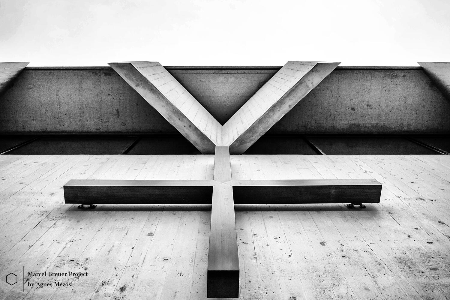 Dramatic black and white architectural detail of a concrete cross-structure at Baldegg Kloster