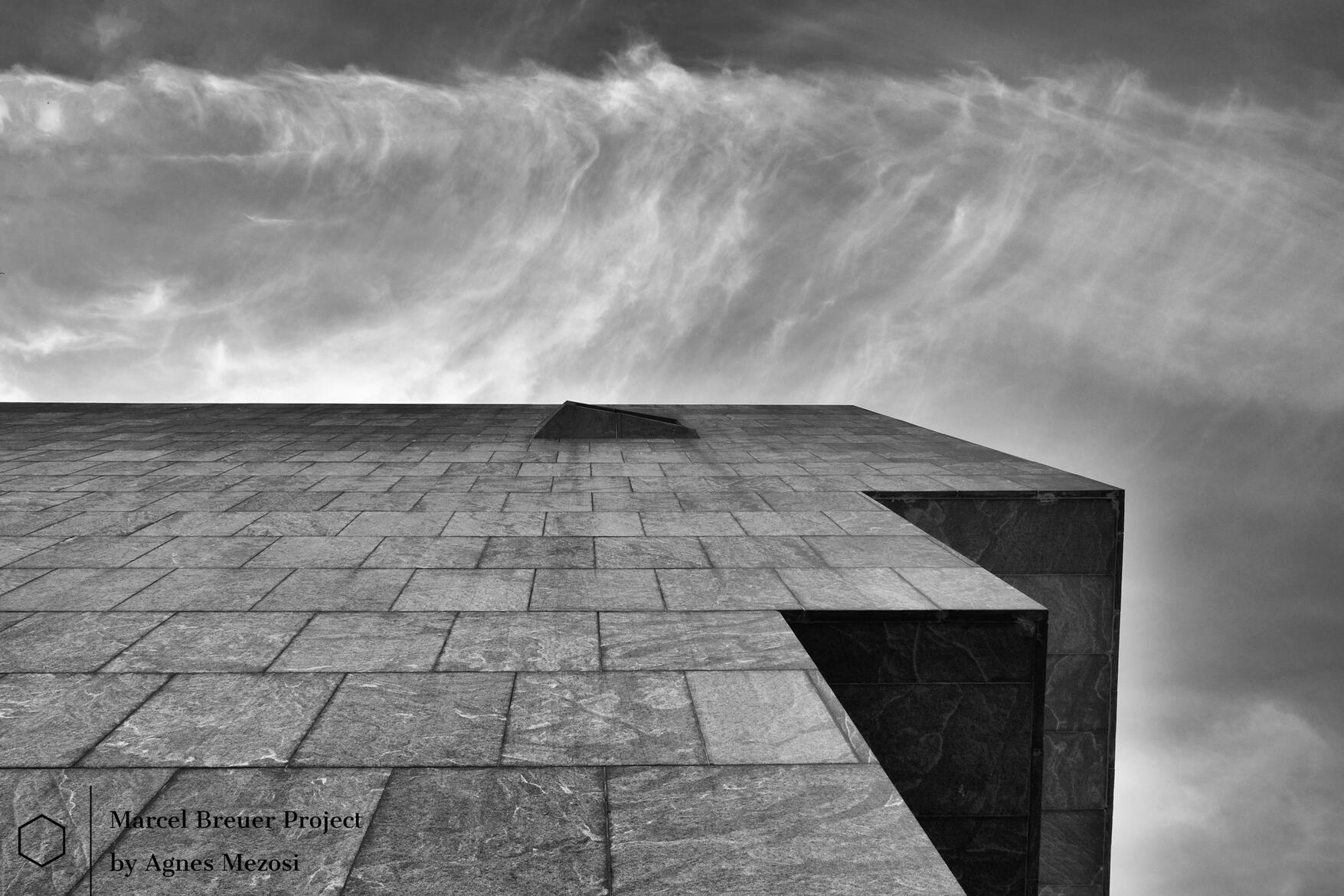 Marcel Breuer Whitney Museum - Granite facade against cloudy sky