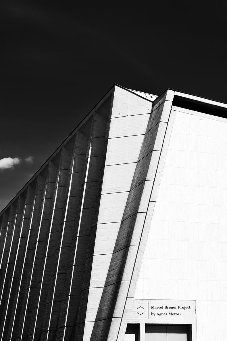 Abstract architectural shots of the UNESCO building's exterior, focusing on the sharp, vertical concrete fins and the deep shadows cast by the Parisian sun.