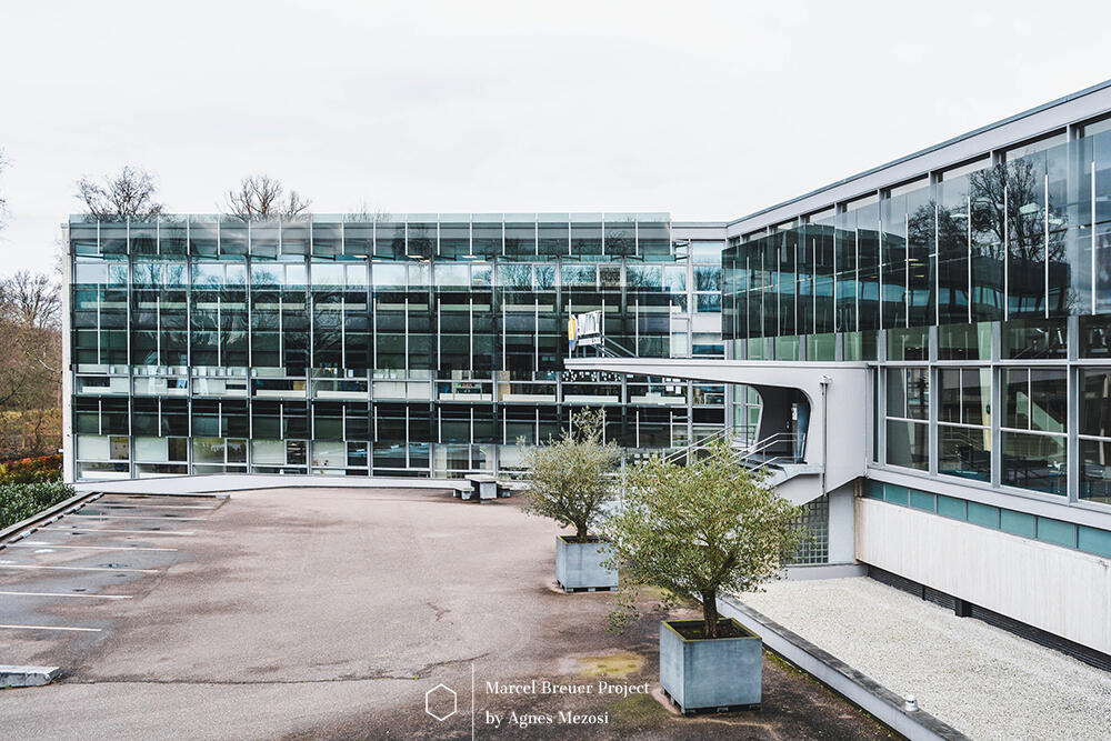 A wide-angle view of the Y-shaped headquarters, showcasing the modernist building's silhouette in Amstelveen.